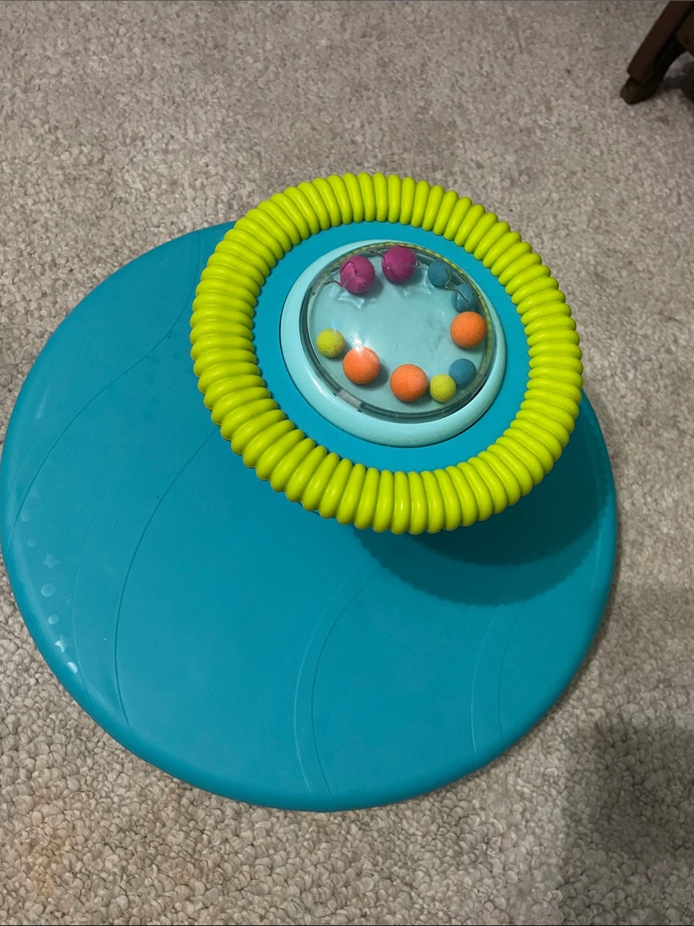 Sit n’ spin Teal and Yellow Spinning seat Toy for Kids Interactive Sensory Play